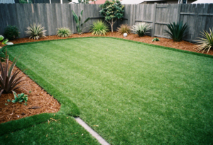 backyard with freshly installed premium artificial turf lawn