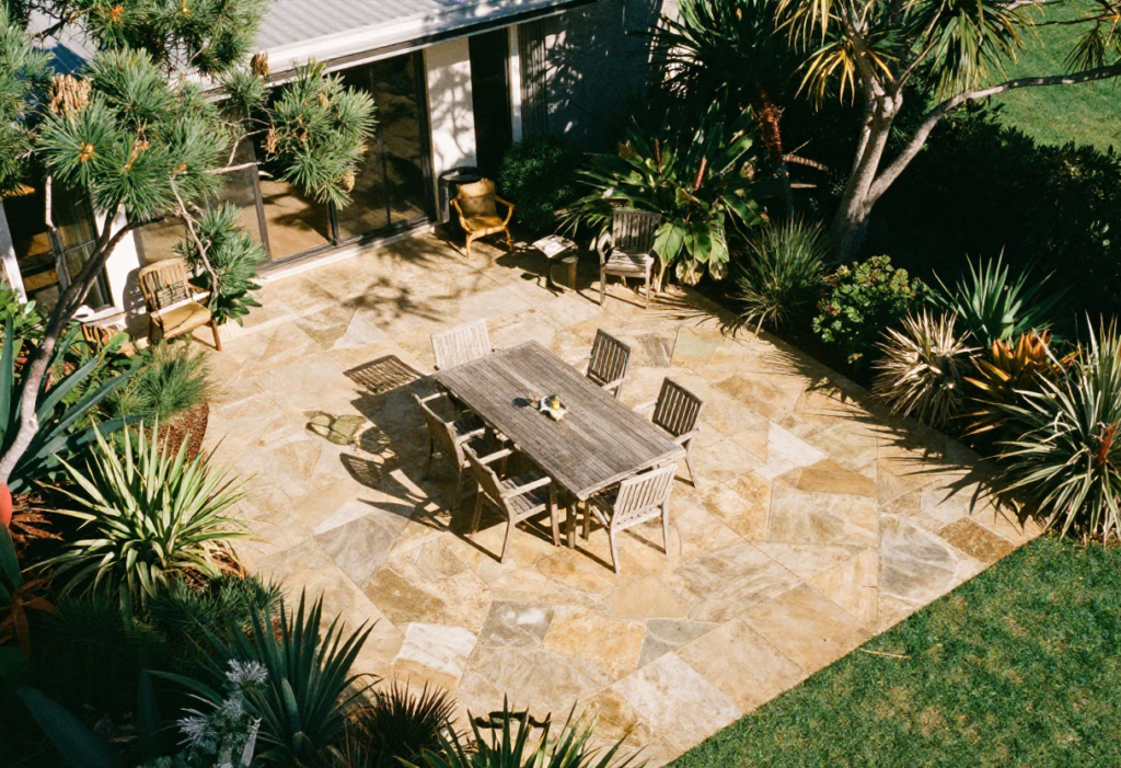 entertaining area with honey-toned sandstone paving in random ashlar pattern